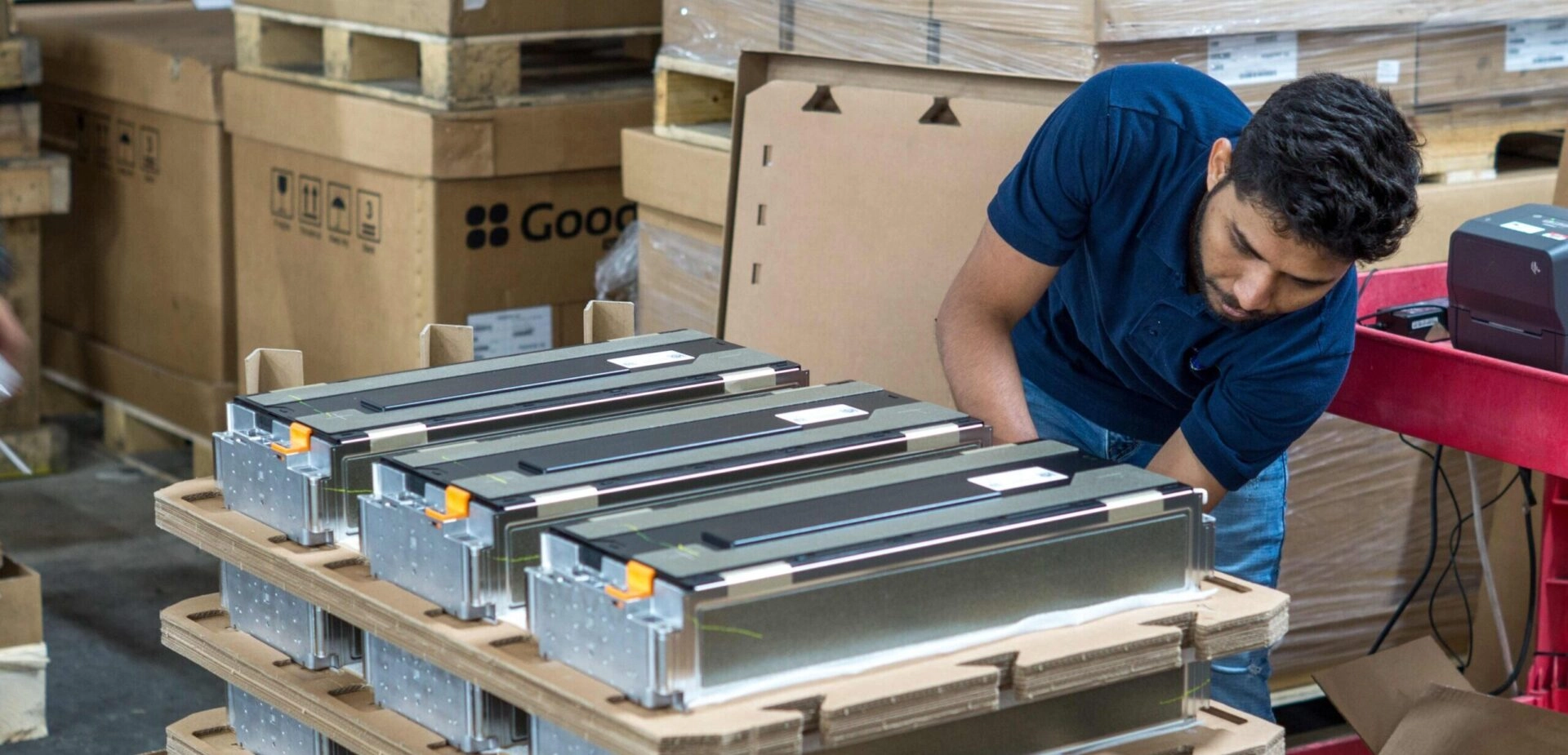 TRIGO quality expert inspecting batteries in a facility in Canada