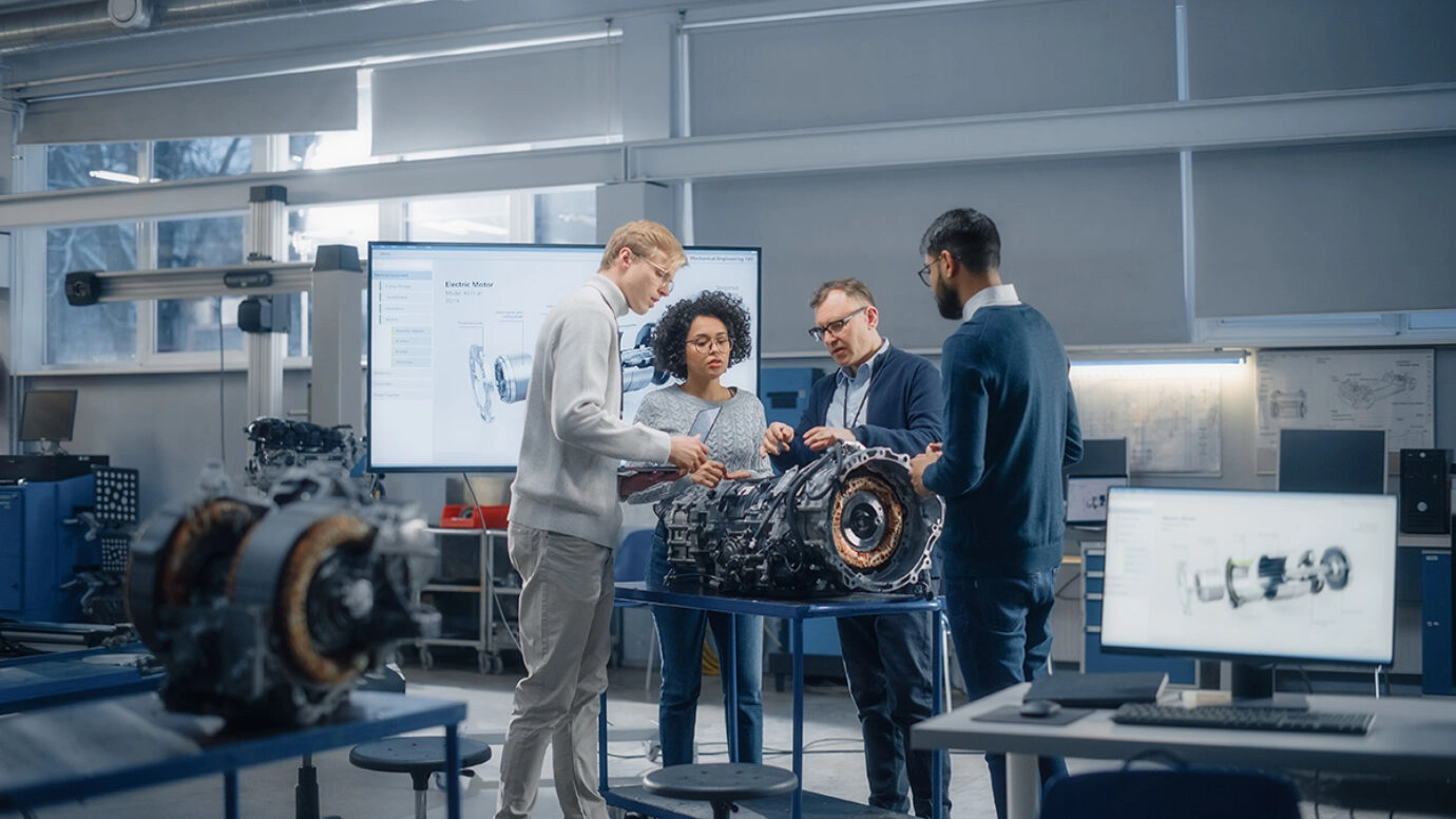 Group of engineers checking an engine