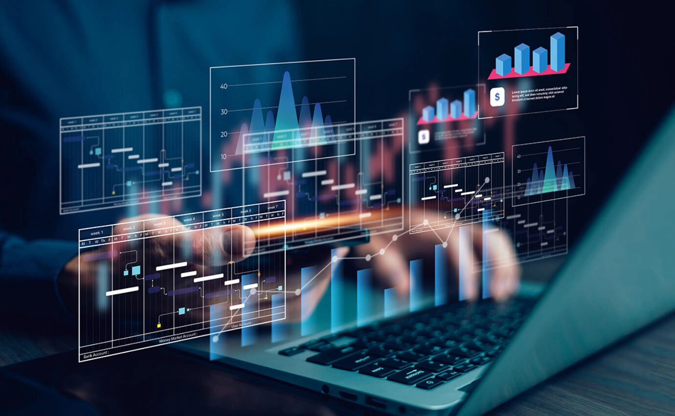 Laptop and data analysis graphic.